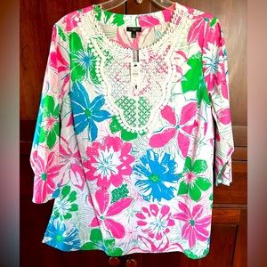 Floral with white decorative neck trim. Machine wash. 100% cotton. New with tags